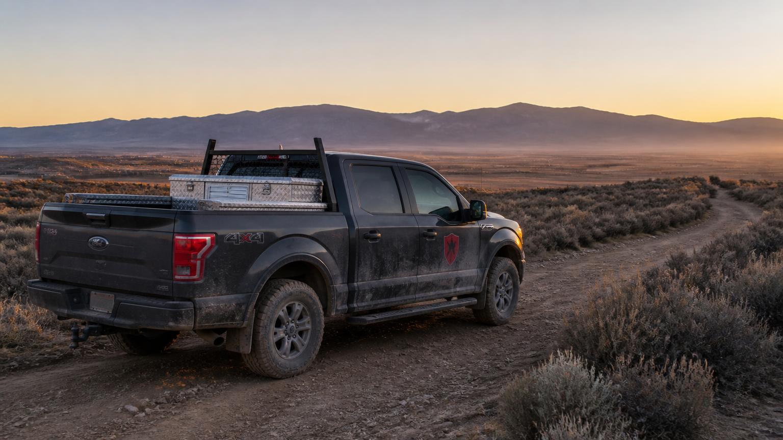 Gorilla Drillers F-150 crew truck on a desert two-track at sunrise